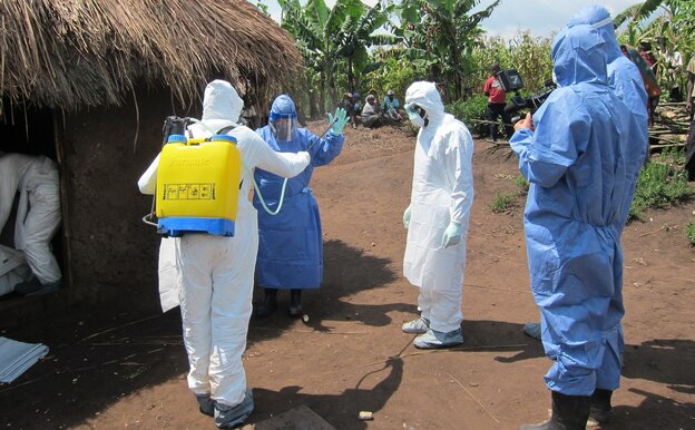Disease detective Dr. Barbara Knust suits up to investigate an Ebola outbreak in Uganda last month. Knust chatted on Twitter last Wednesday about her career tracking down outbreaks for the Centers of Disease and Prevention.