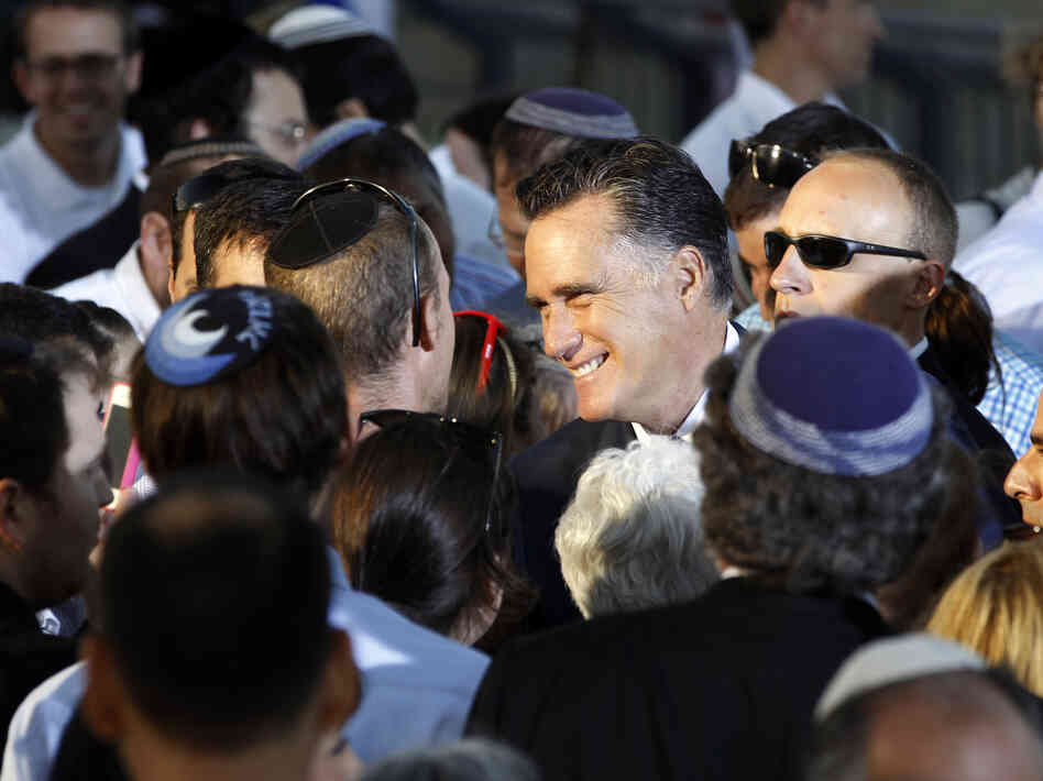 Republican Mitt Romney greets audience members after delivering a speech in Jerusalem on July 29. Israel's new prominence in campaign rhetoric has some in the Jewish state worried.