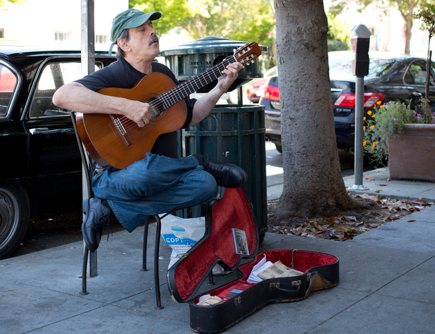 "My first memories are listening to music and feeling my body tingle," says Philip Rosheger, a classical guitarist who performs outdoors in Berkeley, Calif.
