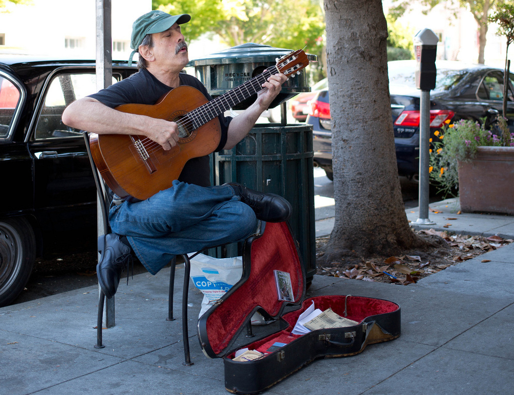 "My first memories are listening to music and feeling my body tingle," says Philip Rosheger, a classical guitarist who performs outdoors in Berkeley, Calif.
