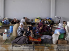 Syrians take refuge Thursday at the Bab Al-Salameh border crossing near the Syrian town of Azaz, in hopes of entering one of the refugee camps in Turkey. Syrians take refuge Thursday at the Bab Al-Salameh border crossing near the Syrian town of Azaz, in hopes of entering one of the refugee camps in Turkey.