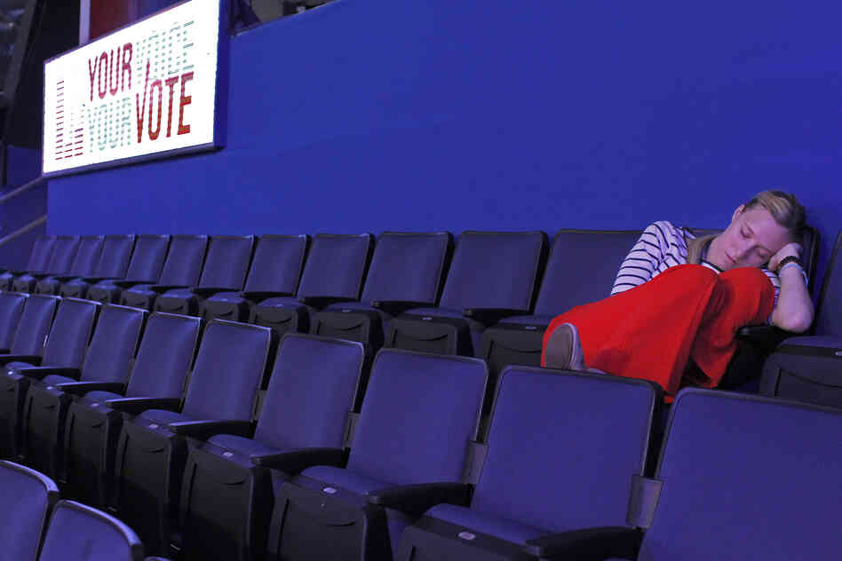 An early-arriving delegate takes a nap several hours before the final session of the convention.