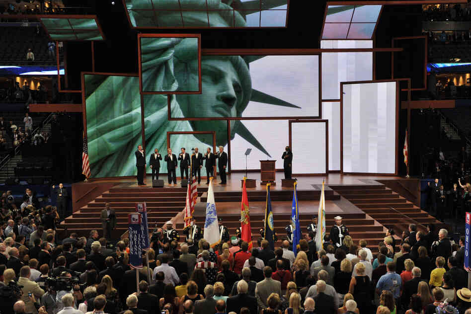 The group Seven sings the national anthem.