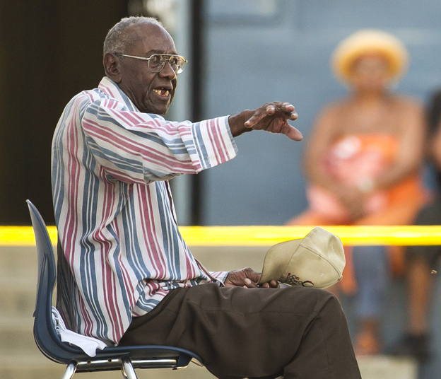 Senior driver Preston Carter, 100, talks with police officers after police say his car went onto a sidewalk and plowed into a group of parents and children outside a South Los Angeles elementary school on Wednesday.