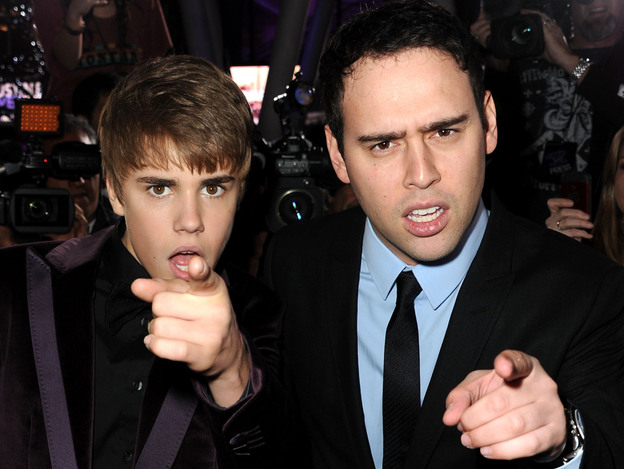 Justin Bieber and manager Scooter Braun last year.