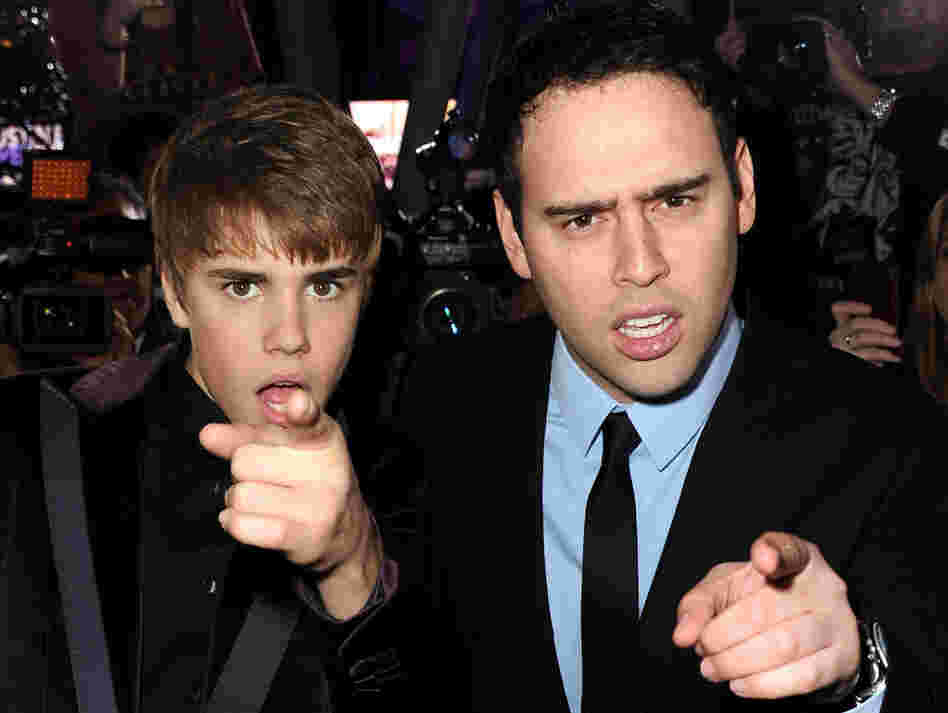 Justin Bieber and manager Scooter Braun last year.