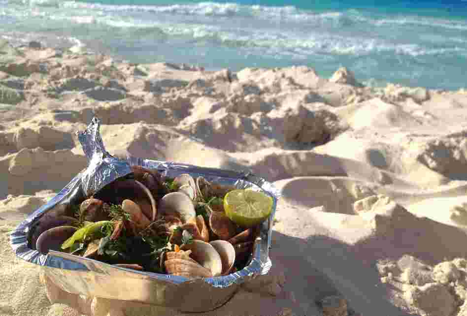 Gandoufly steamed clams are a favorite snack on Egypt's Mediterranean coast, where Egyptians flock on the weekends to escape Cairo's heat and humidity. Gandoufly steamed clams are a favorite snack on Egypt's Mediterranean coast, where Egyptians flock on the weekends to escape Cairo's heat and humidity.