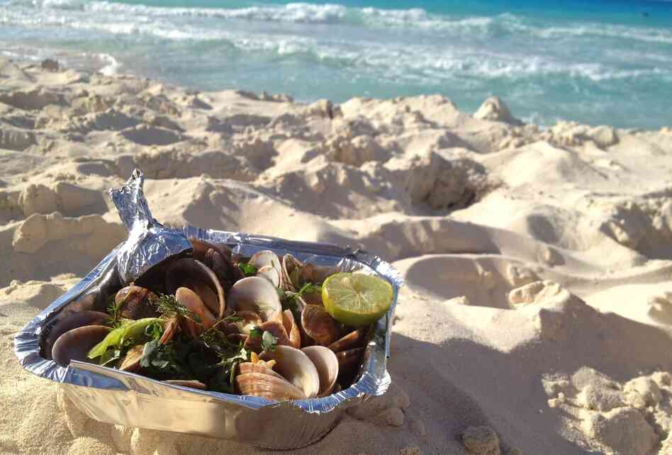 Gandoufly steamed clams are a favorite snack on Egypt's Mediterranean coast, where Egyptians flock on the weekends to escape Cairo's heat and humidity. Gandoufly steamed clams are a favorite snack on Egypt's Mediterranean coast, where Egyptians flock on the weekends to escape Cairo's heat and humidity.