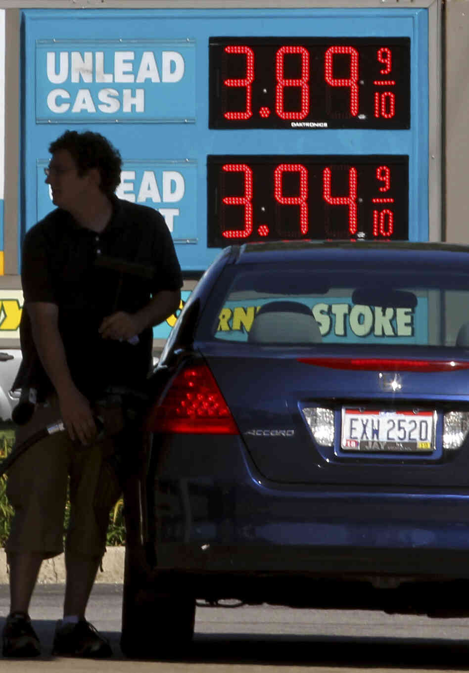 A man fills his gas tank Wednesday in Lyndhurst, Ohio. Gas prices surged as Isaac approached, but are expected to ease after Labor Day.