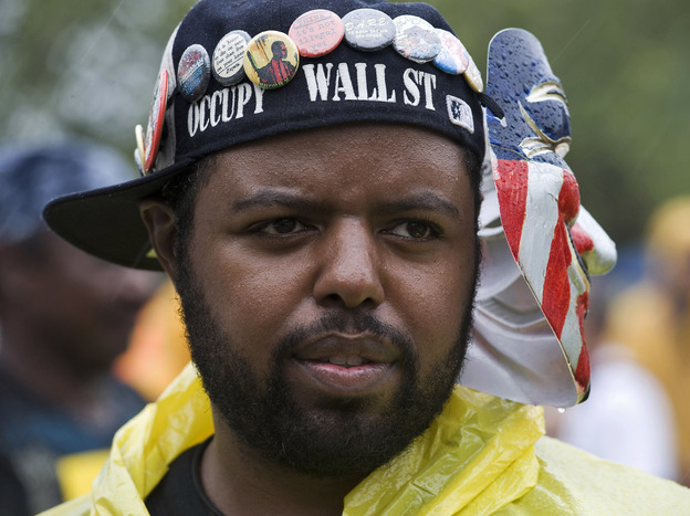 Occupy Wall Street activist Jason Woody listens to a speaker during a rally before the start of the Republican National Convention in Tampa, Fla., on Aug. 27.