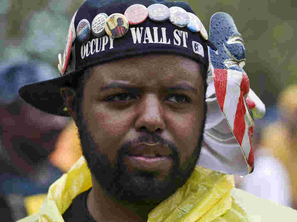 Occupy Wall Street activist Jason Woody listens to a speaker during a rally before the start of the Republican National Convention in Tampa, Fla., on Aug. 27.