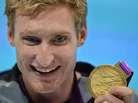 U.S. swimmer Bradley Snyder poses with his gold medal after winning the men's 100m freestyle - S11 final at the London 2012 Paralympic Games. U.S. swimmer Bradley Snyder poses with his gold medal after winning the men's 100m freestyle - S11 final at the London 2012 Paralympic Games.