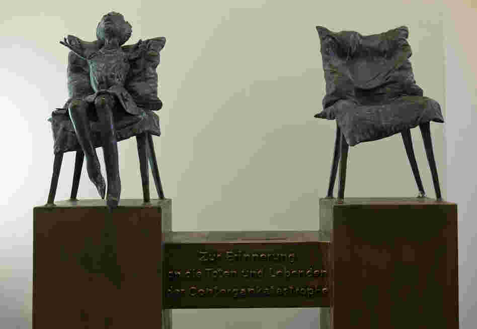A sculpture by the artist Bonifatius Stirnberg memorializes the victims of thalidomide, a drug that caused thousands of birth defects. A translation of the German text below the chairs: "In memory of the dead and the survivors of the thalidomide catastrophe." A sculpture by the artist Bonifatius Stirnberg memorializes the victims of thalidomide, a drug that caused thousands of birth defects. A translation of the German text below the chairs: "In memory of the dead and the survivors of the thalidomide catastrophe."