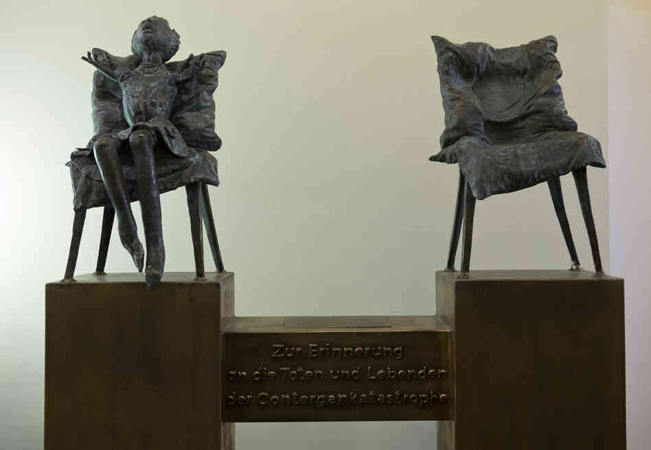 A sculpture by the artist Bonifatius Stirnberg memorializes the victims of thalidomide, a drug that caused thousands of birth defects. A translation of the German text below the chairs: "In memory of the dead and the survivors of the thalidomide catastrophe." A sculpture by the artist Bonifatius Stirnberg memorializes the victims of thalidomide, a drug that caused thousands of birth defects. A translation of the German text below the chairs: "In memory of the dead and the survivors of the thalidomide catastrophe."