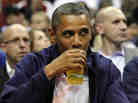 President Obama drinks a beer — that's presumably not from the White House — as he watches the U.S. men's basketball team play Brazil in an Olympic exhibition game in July. President Obama drinks a beer — that's presumably not from the White House — as he watches the U.S. men's basketball team play Brazil in an Olympic exhibition game in July.