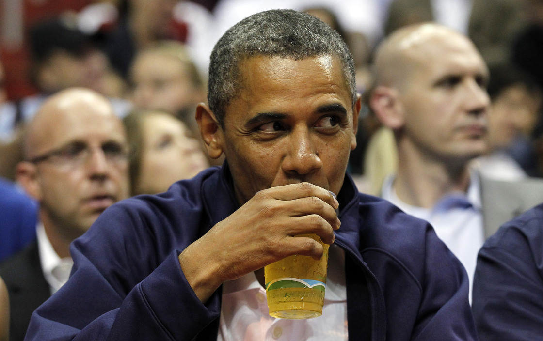 President Obama drinks a beer — that's presumably not from the White House — as he watches the U.S. men's basketball team play Brazil in an Olympic exhibition game in July.