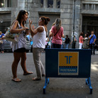 Striking Hellenic Postbank workers chat outside the state-owned bank's headquarters in Athens on Thursday. The union is protesting the government's plan to sell its majority share in the lender. Striking Hellenic Postbank workers chat outside the state-owned bank's headquarters in Athens on Thursday. The union is protesting the government's plan to sell its majority share in the lender.