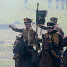Members of historical clubs, dressed as Russian cavalry, advance during the 2010 re-enactment of the 1812 battle between Napoleon's army and Russian troops in Borodino.