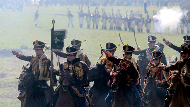Members of historical clubs, dressed as Russian cavalry, advance during the 2010 re-enactment of the 1812 battle between Napoleon's army and Russian troops in Borodino.
