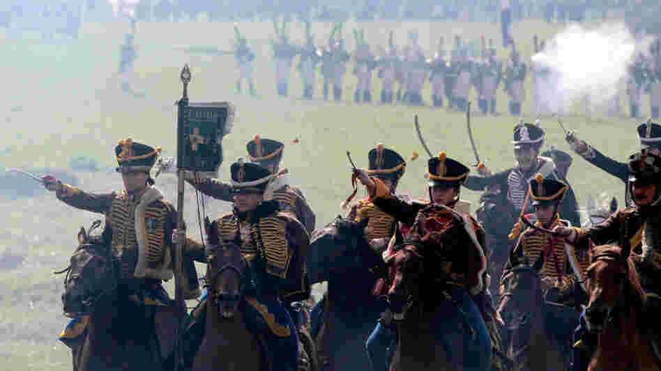 Members of historical clubs, dressed as Russian cavalry, advance during the 2010 re-enactment of the 1812 battle between Napoleon's army and Russian troops in Borodino.