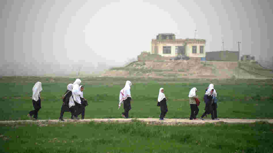 Afghan girls walk home from school in Kunduz province earlier this year. Despite progress in recent years, girls who want an education face threats from the Taliban and other extremists, and sometimes even their own families. Afghan girls walk home from school in Kunduz province earlier this year. Despite progress in recent years, girls who want an education face threats from the Taliban and other extremists, and sometimes even their own families.