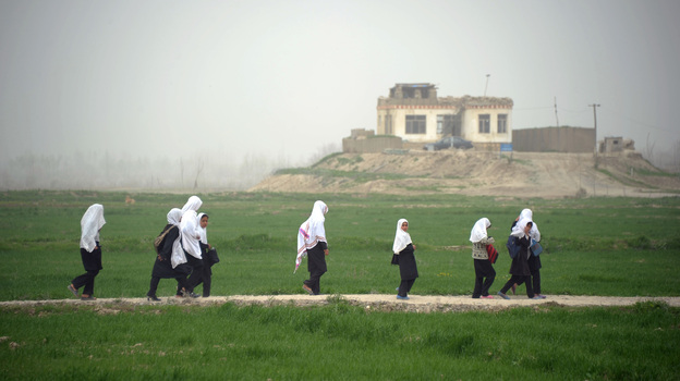 Afghan girls walk home from school in Kunduz province earlier this year. Despite progress in recent years, girls who want an education face threats from the Taliban and other extremists, and sometimes even their own families. Afghan girls walk home from school in Kunduz province earlier this year. Despite progress in recent years, girls who want an education face threats from the Taliban and other extremists, and sometimes even their own families.