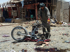 An Afghan man inspects a motorcycle used in a suicide attack in a parking lot holding dozens of trucks supplying the NATO-run Kandahar Air Base in June. Bombings and assassinations are on the rise in Kandahar. Last month, a suicide bomber struck the convoy of the provincial police chief, Gen. Abdul Raziq, who was severely injured. An Afghan man inspects a motorcycle used in a suicide attack in a parking lot holding dozens of trucks supplying the NATO-run Kandahar Air Base in June. Bombings and assassinations are on the rise in Kandahar. Last month, a suicide bomber struck the convoy of the provincial police chief, Gen. Abdul Raziq, who was severely injured.