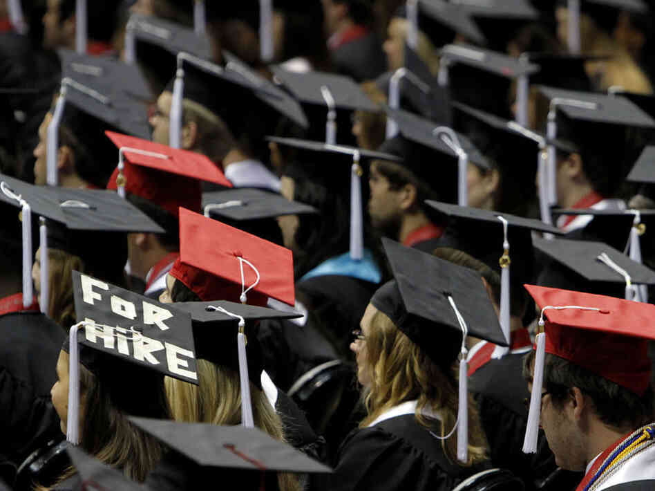 Graduates attend a ceremony at the University of Alabama in Tuscaloosa. Writer Joel Kotkin notes that many recent college grads are saddled with high debt and dim job prospects. Graduates attend a ceremony at the University of Alabama in Tuscaloosa. Writer Joel Kotkin notes that many recent college grads are saddled with high debt and dim job prospects.