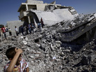 Syrians gather by the rubble of a house destroyed by shelling in the northern town of Azaz, on the outskirts of Aleppo, on Monday. Syrians gather by the rubble of a house destroyed by shelling in the northern town of Azaz, on the outskirts of Aleppo, on Monday.