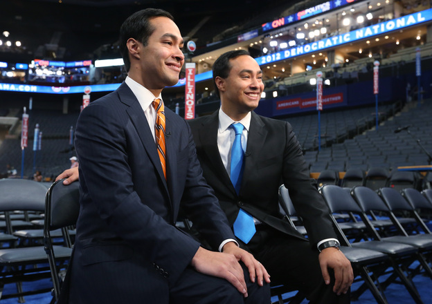 San Antonio Mayor Julian Castro, left, and his twin brother State Rep. Joaquin Castro give an interview during preparations for the Democratic National Convention at Time Warner Cable Arena on Monday.