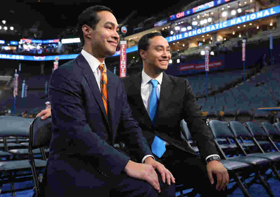 San Antonio Mayor Julian Castro, left, and his twin brother State Rep. Joaquin Castro give an interview during preparations for the Democratic National Convention at Time Warner Cable Arena on Monday.