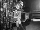 A less complicated time? Petula Clark holds her 1965 gold record for "Downtown," an uptempo song in a major key. A less complicated time? Petula Clark holds her 1965 gold record for "Downtown," an uptempo song in a major key.