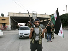 Syrian rebels captured the Bab al-Salam crossing on the border with Turkey in July. Large numbers of refugees fleeing northern Syria for Turkey come to the crossing, which is orderly and well-run, at least for now. Syrian rebels captured the Bab al-Salam crossing on the border with Turkey in July. Large numbers of refugees fleeing northern Syria for Turkey come to the crossing, which is orderly and well-run, at least for now.