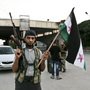 Syrian rebels captured the Bab al-Salam crossing on the border with Turkey in July. Large numbers of refugees fleeing northern Syria for Turkey come to the crossing, which is orderly and well-run, at least for now. Syrian rebels captured the Bab al-Salam crossing on the border with Turkey in July. Large numbers of refugees fleeing northern Syria for Turkey come to the crossing, which is orderly and well-run, at least for now.