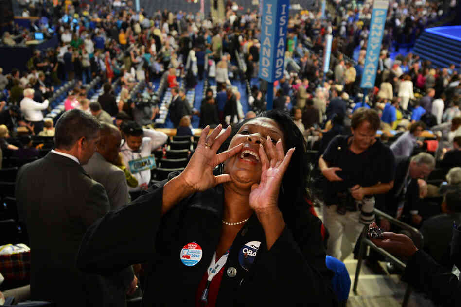 Jennifer Vidrine, the mayor of Ville Platte, La., cheers before the start of the convention. "The spirit is high, the energy is high," she said.