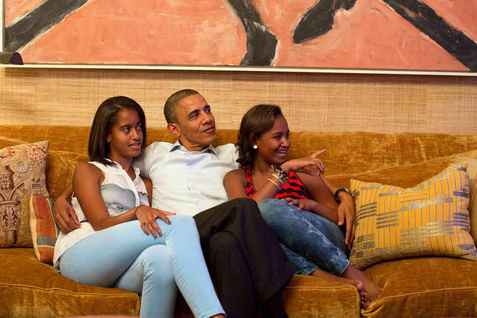 President Obama and his daughters, Malia (left) and Sasha, watch the first lady's speech on television at the White House.