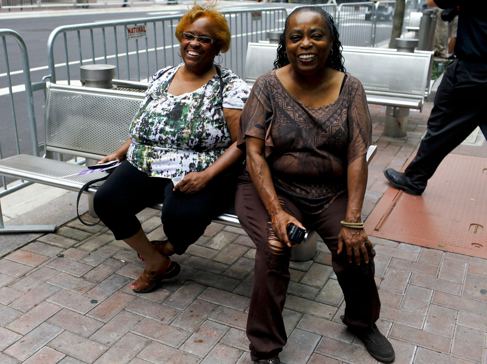 Creola Boswell (left) and her sister Susie Collins flew to Charlotte from California to enjoy the convention atmosphere.