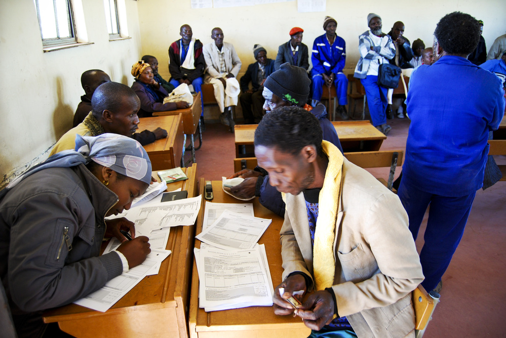 A team of paralegals interview former miners in a primary school in Bizana, in South Africa's rural Eastern Cape province. The legal team is screening miners to see if they have lung disease. It's part of a class-action lawsuit against South African gold mining companies.