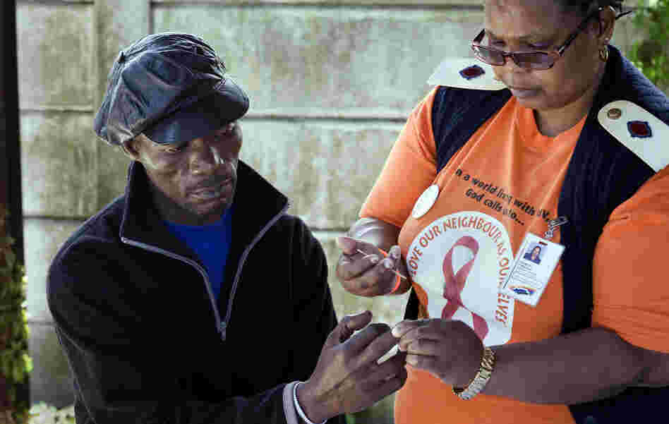 Nurse Irena Majola tests Justice Mlambo's blood for HIV at a roadside AIDS testing table in a suburb near Cape Town. Under the "test and treat" strategy, about 45 million South Africans would need to be screened for HIV each year. Nurse Irena Majola tests Justice Mlambo's blood for HIV at a roadside AIDS testing table in a suburb near Cape Town. Under the "test and treat" strategy, about 45 million South Africans would need to be screened for HIV each year.