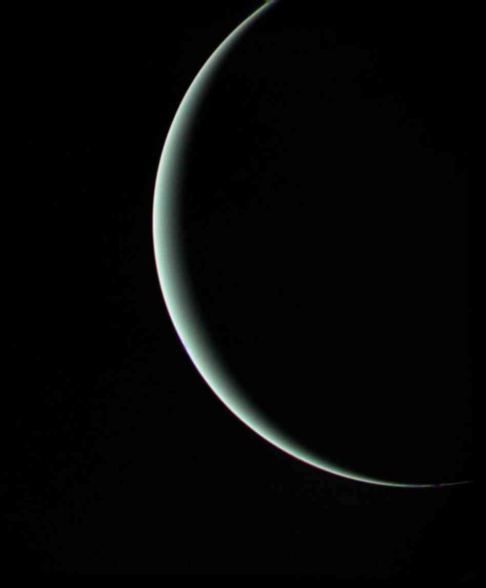 After the Voyager craft surveyed Jupiter and Saturn, NASA extended their mission and sent Voyager 2 on to Uranus and Neptune. Voyager 1 kept traveling outward. This image of Uranus was captured by Voyager 2 in 1986, when it was about 600,000 miles from the planet. Uranus' pale blue-green color is a result of methane in the atmosphere.