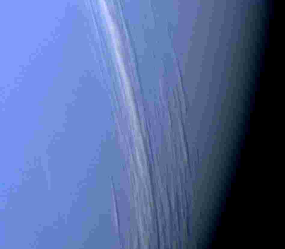 About three years later, in 1989, Voyager 2 reached Neptune, where it captured this high-resolution color image, which shows bright cloud streaks on the planet.