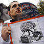 Russia is suffering from an exodus of educated, talented citizens, including scientists. Here, scientists rally in Moscow to demand the government increase funding for science last October.