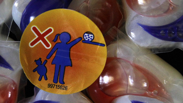 A label warns parents to keep Tide laundry detergent packets away from small children. A label warns parents to keep Tide laundry detergent packets away from small children.