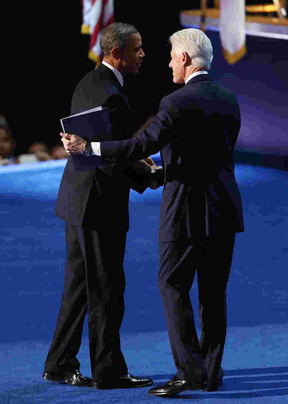 President Obama greets former President Bill Clinton onstage at the Democratic National Convention. President Obama greets former President Bill Clinton onstage at the Democratic National Convention.