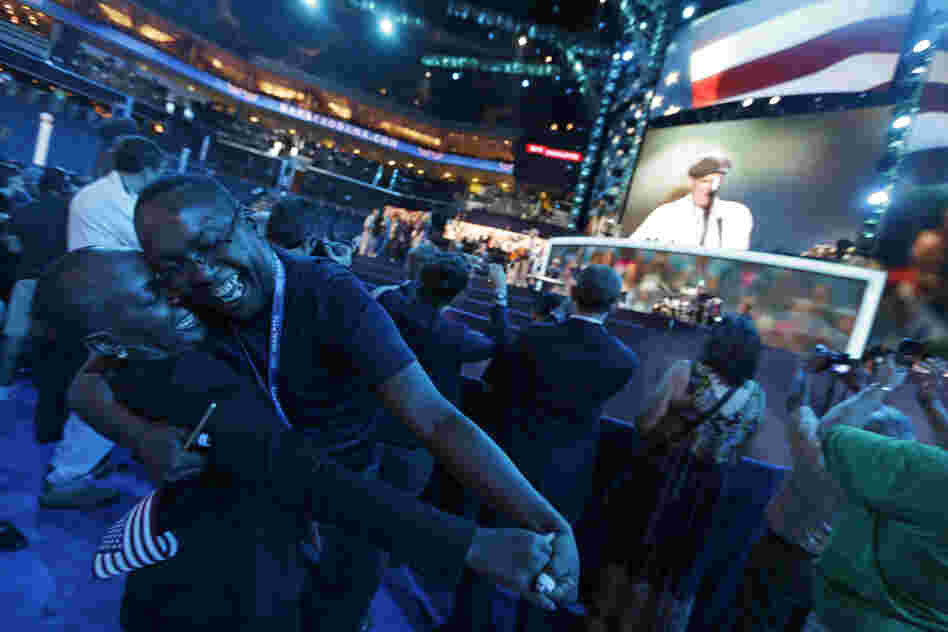 North Carolina delegates Denise Adams and Charles Evans dance as Taylor sings "How Sweet It Is to Be Loved by You," during a sound check.