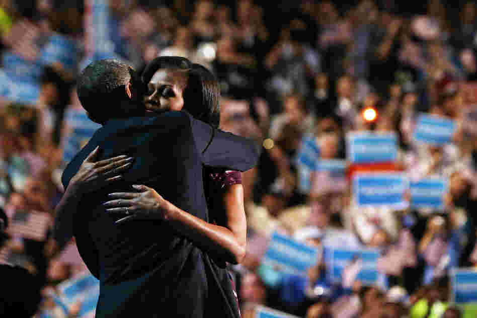 First lady Michelle Obama hugs the president on stage after introducing him during the final night of the convention.