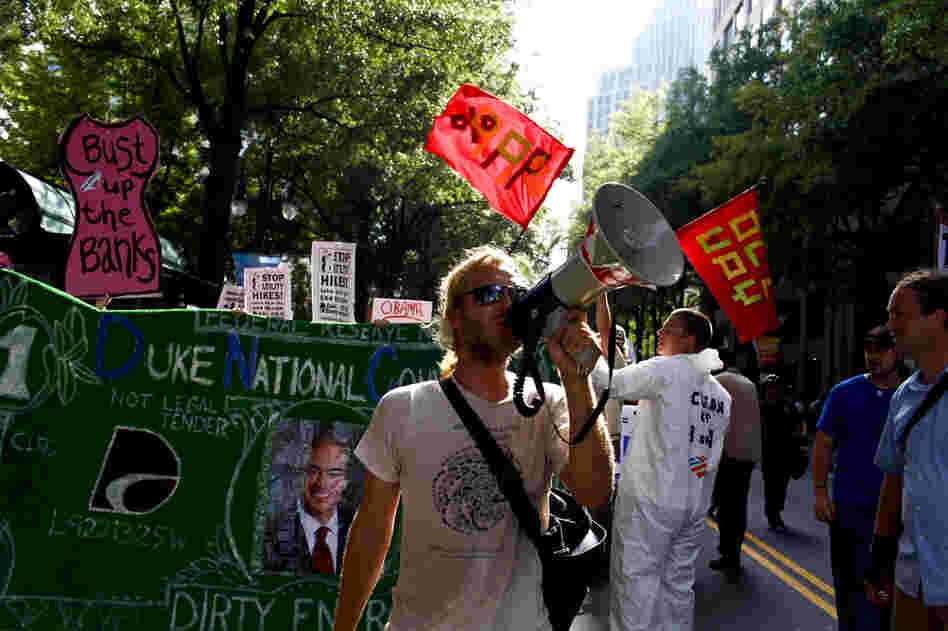 A group of roughly 100 Occupy protestors took to the streets in Charlotte on Wednesday. Occupiers marched relatively peacefully down Tryon St. a few blocks away from the Time Warner Cable Arena.