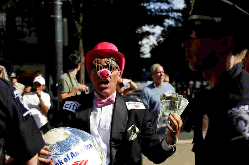 Members of Code Pink dressed as members of the 1 percent to protest. Members of Code Pink dressed as members of the 1 percent to protest.