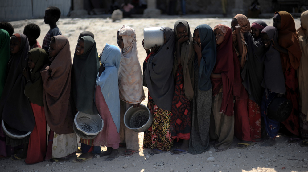 Somali girls line up to receive a hot meal in Mogadishu last year after the worst drought in the Horn of Africa in decades, compounded by war, put millions in danger of starvation.