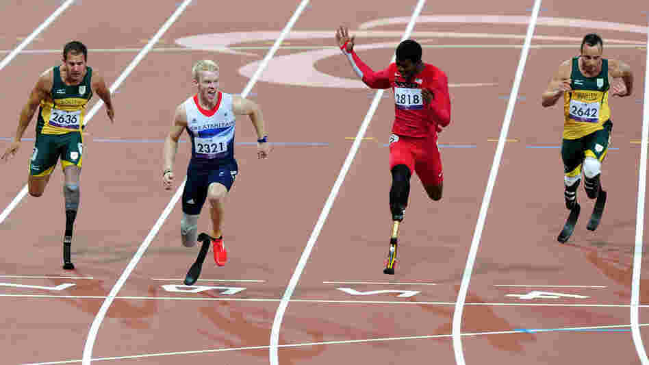 Bronze medalist Arnu Fourie of South Africa (from left), gold medalist Jonnie Peacock of Great Britain, silver medalist Richard Browne of the United States and Oscar Pistorius of South Africa cross the line in the Men's 100m - T44 Final at London's Olympic Stadium.